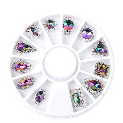 China Fashion and Charm 12Pcs/Box Flame Abs Glitter Crown Waterdrop Alloy Nail Art Decoration Wheel 3D Charm Symphony Rhinestone Jewelry Tools for sale