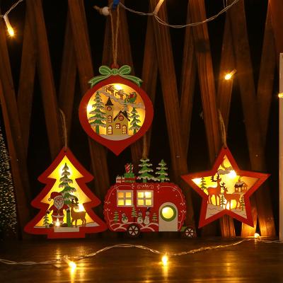 China New Chirstmas Decor 2022 Christmas Tree Ornaments Small Cavity Ornaments Creative Wooden Hanging Luminous Car Gifts for sale