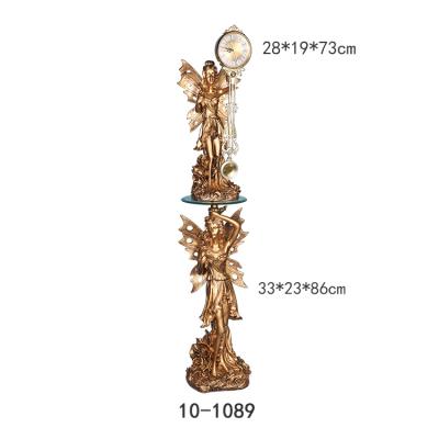 China Antique Style Resin Golden Elf Home Decor Cheap Modern Pendulum Clock For Hotel for sale