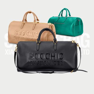 China Leather or PU customized large leather duffel bag with embossing logo for unisex men and women for sale