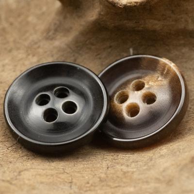 China Sustainable Decorative Buttons Genuine Horn 4 Holes Irregular Dark Brown Clothing Pants Suit Sleeve Sweater Wholesale Coffee 15mm/18mm for sale