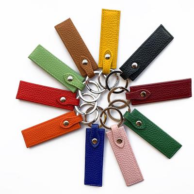 China Business Hot Selling Genuine Leather Band Shape Bracelet Lanyard Girly Keychains For Bags for sale