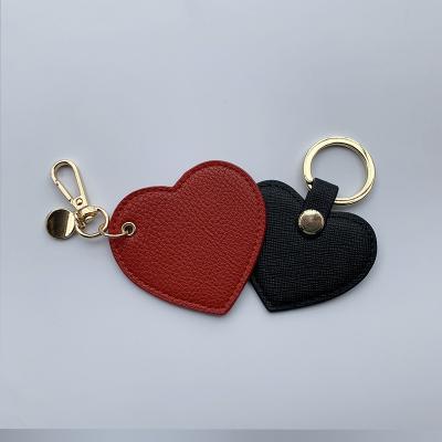 China Genuine Leather Custom Design Heart Shape Rose Leather Backing Key Chain Bracelet for sale