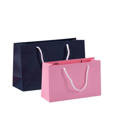 China Recyclable Foldable Eco Friendly Custom Paper Shopping Bag Handle Tote Bags Garment Packaging Logo Printed Pink Paper for sale