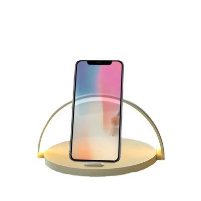 China 2022 New Design Mold Mobile Phone Functional Led Night Lamp Qi Dimming Stepless Touchless Wireless Charger With Cell Phone Stand Holder for sale