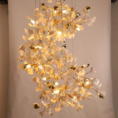 China Modern New Style Leaf Brass Chandelier Long Hanging Nordic Creative Ginkgo Ceramic Leaf Chandelier Gold Luxury Chandelier With Leaves for sale