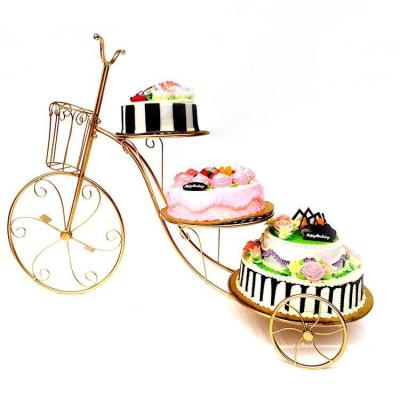 China Disposable three-layer hot sale wrought iron cake rack bicycle multi-layer Amazon birthday display stand for sale