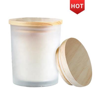 China Luxury Private Label Candle Jars With Wood Lid Bulk For Home Decor Empty Frosted Glass Candle Ships Container Holders for sale