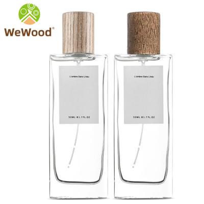 China Europe 50ml Sample Perfumes Bottles For Sale Small Spray Empty Glass Perfume Bottle With Pump And Wooden Cap for sale