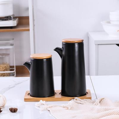 China Sustainable Wholesale Restaurant Used Black Oil Dispenser Ceramic Vinegar Condiment Set Set With Wooden Stand for sale