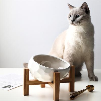 China Viable Wholesale Custom Unique Design Color Dogs Cat Food Ceramic Feeder Round Pet Bowls With Wooden Shelf for sale