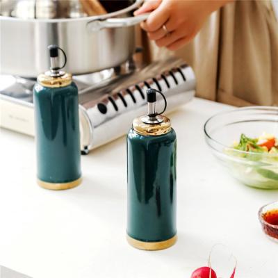 China New Design Fancy Steamable Porcelain Vinegar Cheap Green Oil Bottle Oil Dispenser for sale