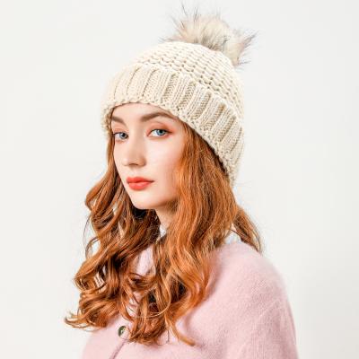 China Wholesale JOINT Winter Hat Woman Iceland Chat Logo Custom Winter Unisex Women Knitted Pom Pom Fur Beanie Hat for sale