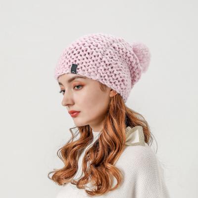 China COMMON Wholesale Pink Beanie Hats Winter Pom Pom Custom Hats For Women for sale