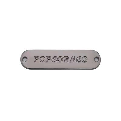 China Viable Metal Logo For Swimwear OEM ODM Engraved Metal Label Clothing Brand Metal Bag Custom Leather for sale