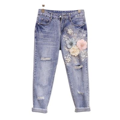 China Direct selling QUICK DRY heavy industry manufacturer broken hole women's jeans autumn embroidery three-dimensional flower nine point pants for sale