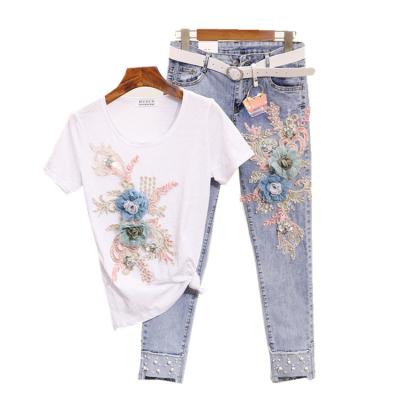 China Summer fashion lady suit heavy work nail bead anti-pilling embroidered three-dimensional flower short-sleeved T-shirt + hollow jeans for sale