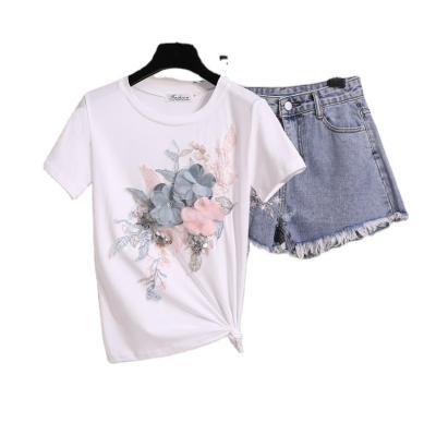 China New women's suit anti-pilling summer two-piece embroidery beaded flower heavy industry sleeve cotton T-shirt + denim tassel short shorts for sale