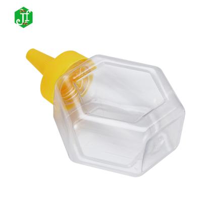 China 2022 New Food Design Hexagon Shape Clear Plastic 500g Honey Squeeze Bottle for sale