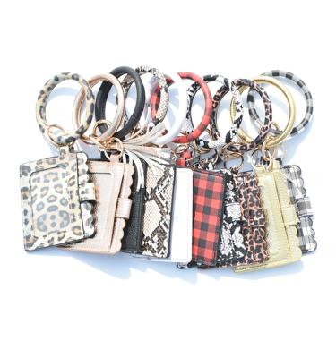 China Fashion Leopard Print Round Leather Purse Bracelet Fashion Leopard Print Coin Clutch Wallet Key Chain Bracelet Key Ring For Women QY955 for sale