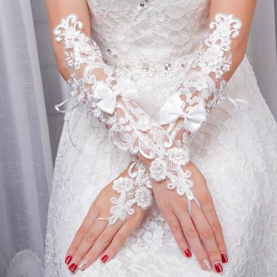 China Wedding Yuan Women's White Lace Long Wedding Gloves Lady Pearl Bow Tie Lace Performance Party Bridal Gloves for sale