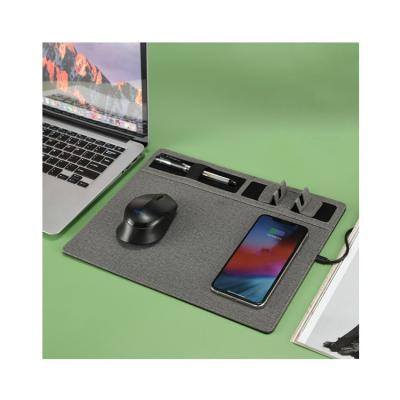 China Multi 4 in 1 Pen Holder Mobile Phone Stand QI Wireless Charger Mouse Pad for sale