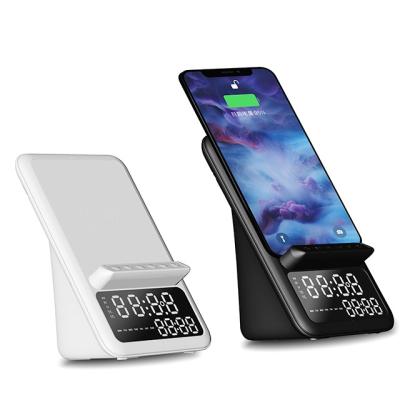 China New arrival 2022 3 in 1 multi function wireless charger phone holder wireless speaker with alarm clock for sale