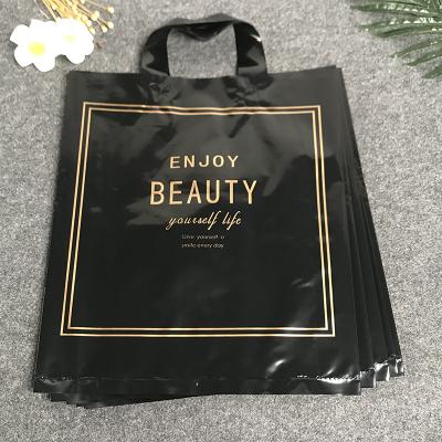 China Custom Printed Plastic Shopping Bag BIODEGRADABLE Clothes Packaging Bag Carry Bags With Own Handle Plastic Logo for sale