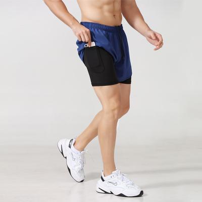 China Sustainable Quick-drying Shorts Spring And New Two-piece Summer Basketball Training Fake Fitness Pants Running Anti-light Sports Shorts Men for sale