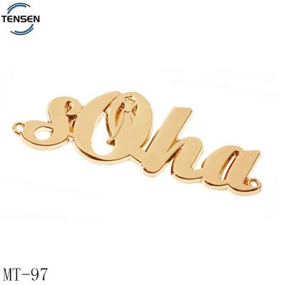 China Viable custom letter apparel tags logo corrosion resistance gold color metal abaya accessory label for swimwear for sale