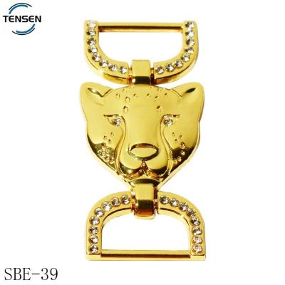 China Custom Embossed Gold Environmental Friendly Buckle Swimwear Design Fashion Logo Side Release Accessories Shoes Buckles With D Clips for sale