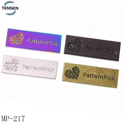 China Good Quality Designer Hats Environmental Friendly Metal Engraving Flat Logos Handbags Stamped Name Metal Emblem For Purse for sale