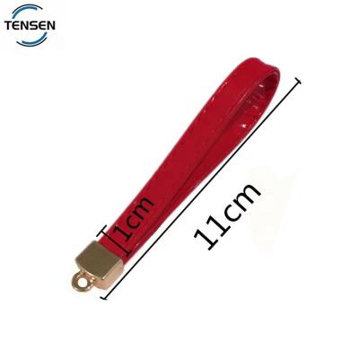 China Environmental Friendly Promotional Cheap Leather Rope Keychain Accessory Tags Custom Design Logo Mute Key Holder Ring Chains for sale