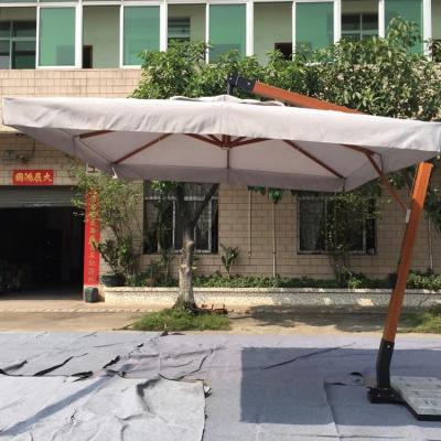 China Outdoor Furniture Giant Wooden Hanging Patio Umbrella With Granite Base for sale