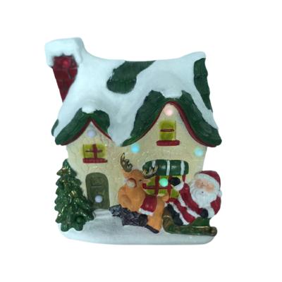 China Other factory original resin house village with battery operated led violy resin house resin christmas house with led light and music for sale