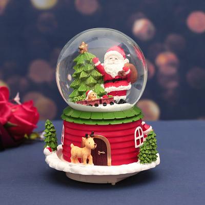 China Worldwide 100mm Christmas Snow Globe with Water 8 Snowball Santa Claus Snowman Music Box music and color lights music for sale