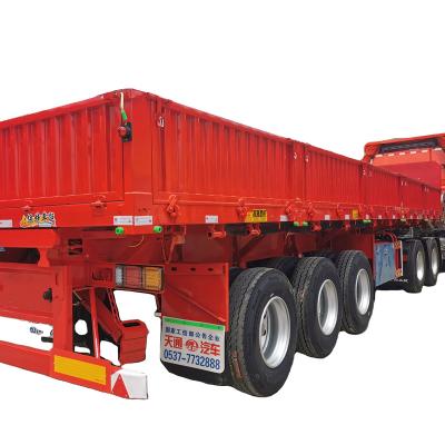 China Truck Trailer A Three Bridge Side Overturning Semi Trailer Truck Trailer For Pulling Sand And Stone Materials for sale