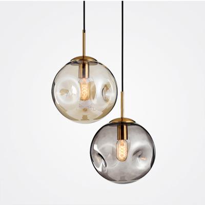 China Nordic modern creative personality small glass ball simple irregular pendant light for restaurant bar bedside for sale