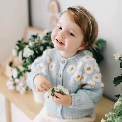 China Daisy Long Sleeve Girl's Anti-Pilling Solid Color Embroidered Round Neck Light Blue Cardigan Sweater for sale