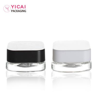 China Personal Care Manufacturer Fancy Design Empty Cosmetics Glass Jars With Black And White Lid For Powder for sale