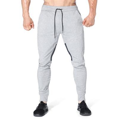 China QUICK DRY Fitness Pants Mens Solid Color Splice Tight Casual Jogging Pants for sale