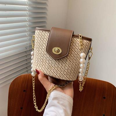 China Korean version of new fashion simple beach bag wave chain bucket beaded straw bag PU woven bag for sale