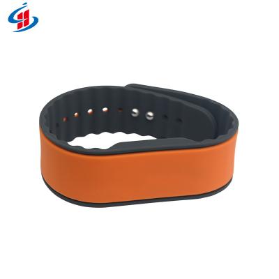 China Waterproof / Waterproof Customize Payment Wristband 125KHz / 13.56Mhz RFID Silicone Wristbands Moneyless NFC Bands for sale