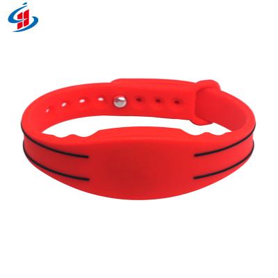 China Waterproof/Waterproof Logo Printed 125KHz/13.56Mhz RFID NFC Wristbands Silicone Wristband For Music Concert for sale