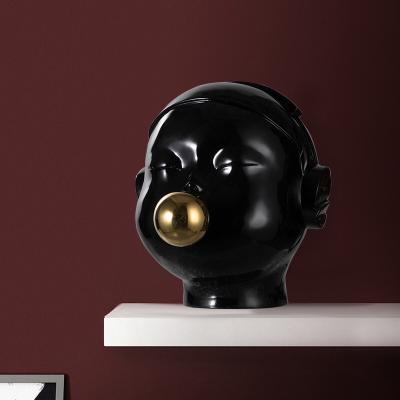 China Artificial Modern Creative Abstract Boy Golden Balloon Resin Sculpture Blowing Statue Ornaments Home Decoration for sale