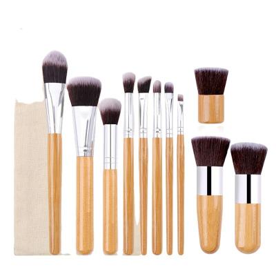 China Professional Logo Natural Bamboo Handle Makeup Brush Custom Made Makeup Brush 11 Pcs Kabuki Cosmetic Brush Set Brush With Bag for sale