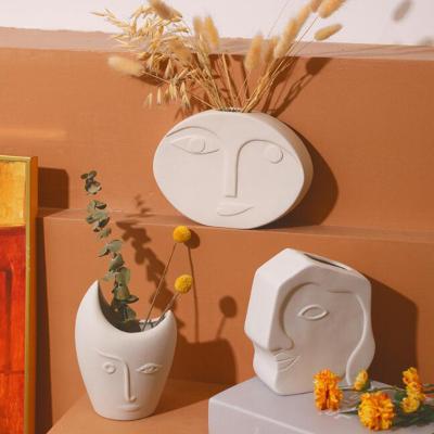 China Home Decor Art Sculpture Abstract Vase Ceramic Vases Statue Flower Pot Ornaments for sale