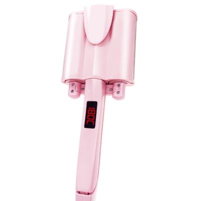 China Professional Electric Rotating Curling Iron Egg Roll Egg Roll Water Ripple Wave Stick Three-tube Pink Curling Iron Large Electric Roll Stick Lazy Buckles for sale