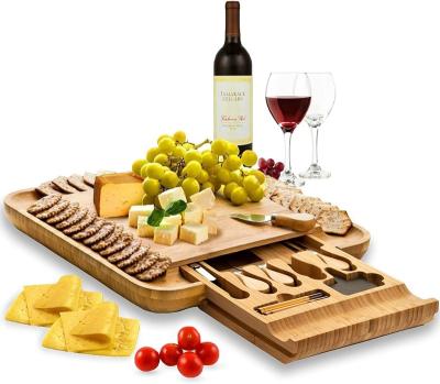 China Modern Ceramic Cheese Board 2 Bowls 2 Serving Plates 4 Magnetic Drawers Bamboo Cutlery Knife Set 2 Server Forks Wine Opener for sale