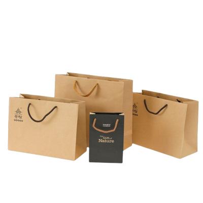 China Recyclable Custom Your Own Logo Printed Recyclable Luxury Kraft Paper Packaging Clothing Paper Shopping Bags With Black Ribbon Handle for sale